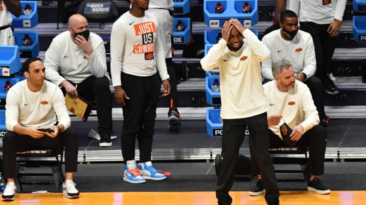 Mar 21, 2021; Indianapolis, Indiana, USA; Oklahoma State Cowboys head coach Mike Boynton reacts from the sidelines during the second half in the second round of the 2021 NCAA Tournament against the Oregon State Beavers at Hinkle Fieldhouse. Mandatory Credit: Patrick Gorski-USA TODAY Sports