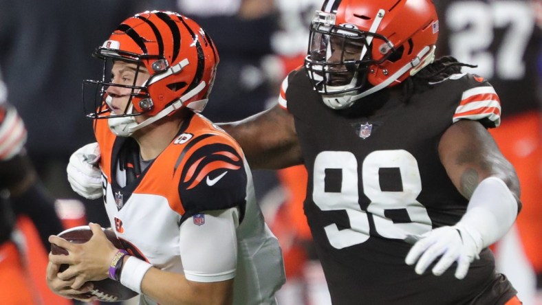 Cleveland Browns defensive tackle Sheldon Richardson (98) sacks Cincinnati Bengals quarterback Joe Burrow (9) during the first half of an NFL football game at FirstEnergy Stadium, Thursday, Sept. 17, 2020, in Cleveland, Ohio. [Jeff Lange/Beacon Journal]

Browns 23