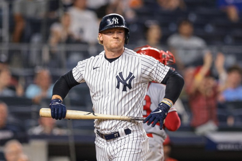 Jun 28, 2021; Bronx, New York, USA; New York Yankees left fielder Clint Frazier (77) reacts after striking out during the seventh inning against the Los Angeles Angels at Yankee Stadium. Mandatory Credit: Vincent Carchietta-USA TODAY Sports