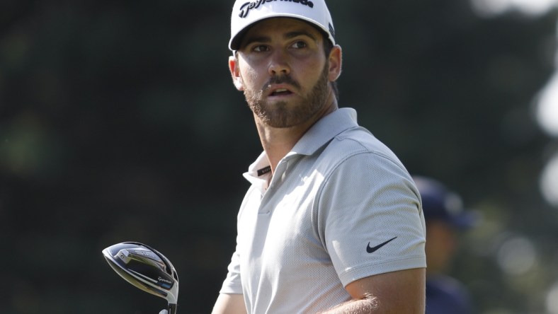 Jul 1, 2021; Detroit, Michigan, USA; Matthew Wolff watches after he tees off on the 17th hole during the first round of the Rocket Mortgage Classic golf tournament. Mandatory Credit: Raj Mehta-USA TODAY Sports