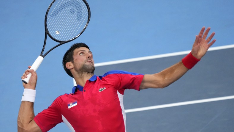 Jul 30, 2021; Tokyo, Japan; Novak Djokovic (SRB) serves against Alexander Zverev (GER) in the men's singles semifinals during the Tokyo 2020 Olympic Summer Games at Ariake Tennis Park. Mandatory Credit: Robert Deutsch-USA TODAY Sports