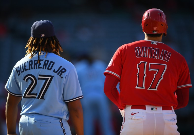 Aug 10, 2021; Anaheim, California, USA;  Toronto Blue Jays first baseman Vladimir Guerrero Jr. (27) and Los Angeles Angels designated hitter Shohei Ohtani (17) stand at first base in the sixth inning at Angel Stadium. Mandatory Credit: Jayne Kamin-Oncea-USA TODAY Sports