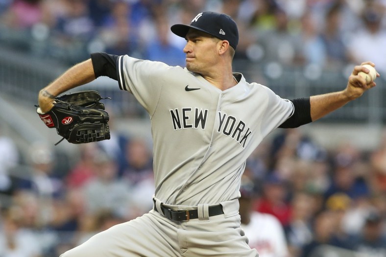 Aug 24, 2021; Atlanta, Georgia, USA; New York Yankees starting pitcher Andrew Heaney (38) throws against the Atlanta Braves in the first inning at Truist Park. Mandatory Credit: Brett Davis-USA TODAY Sports
