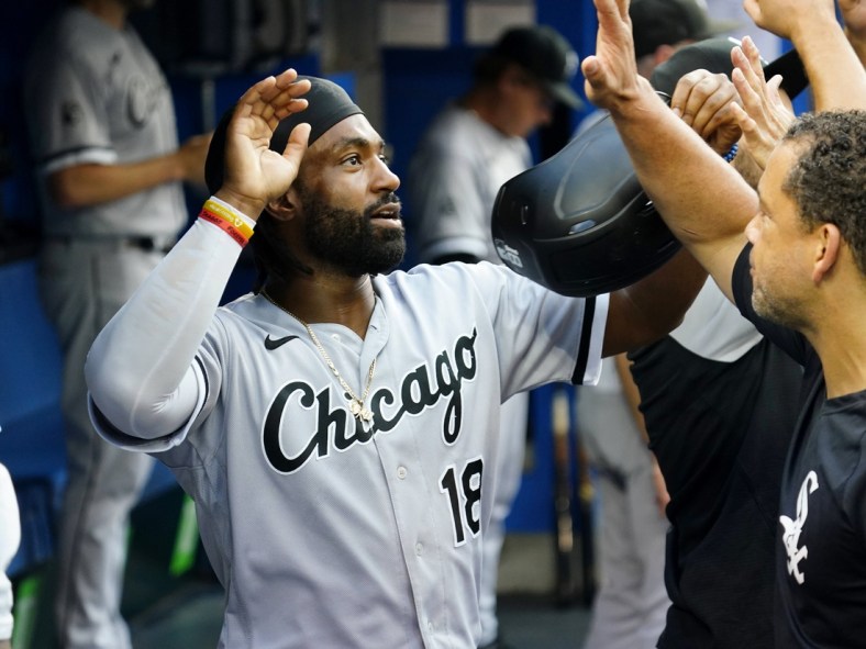 Aug 24, 2021; Toronto, Ontario, CAN; Chicago White Sox right fielder Brian Goodwin (18) celebrates scoring against the Toronto Blue Jays during the first inning at Rogers Centre. Mandatory Credit: John E. Sokolowski-USA TODAY Sports