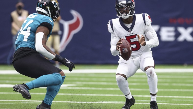 Sep 12, 2021; Houston, Texas, USA; Houston Texans quarterback Tyrod Taylor (5) looks to pass the ball during the second quarter against the Jacksonville Jaguars at NRG Stadium. Mandatory Credit: Troy Taormina-USA TODAY Sports