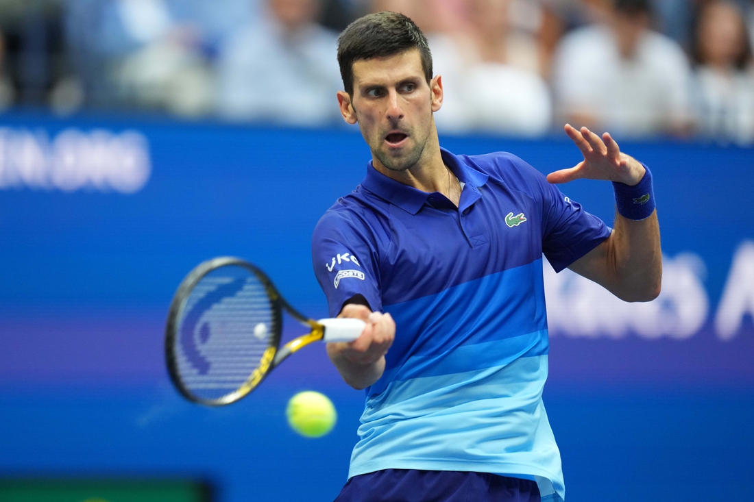 Sep 12, 2021; Flushing, NY, USA; Novak Djokovic of Serbia hits a forehand against Daniil Medvedev of Russia (not pictured) in the men's singles final on day fourteen of the 2021 U.S. Open tennis tournament at USTA Billie Jean King National Tennis Center. Mandatory Credit: Danielle Parhizkaran-USA TODAY Sports