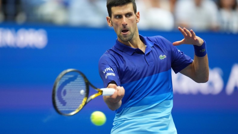 Sep 12, 2021; Flushing, NY, USA; Novak Djokovic of Serbia hits a forehand against Daniil Medvedev of Russia (not pictured) in the men's singles final on day fourteen of the 2021 U.S. Open tennis tournament at USTA Billie Jean King National Tennis Center. Mandatory Credit: Danielle Parhizkaran-USA TODAY Sports