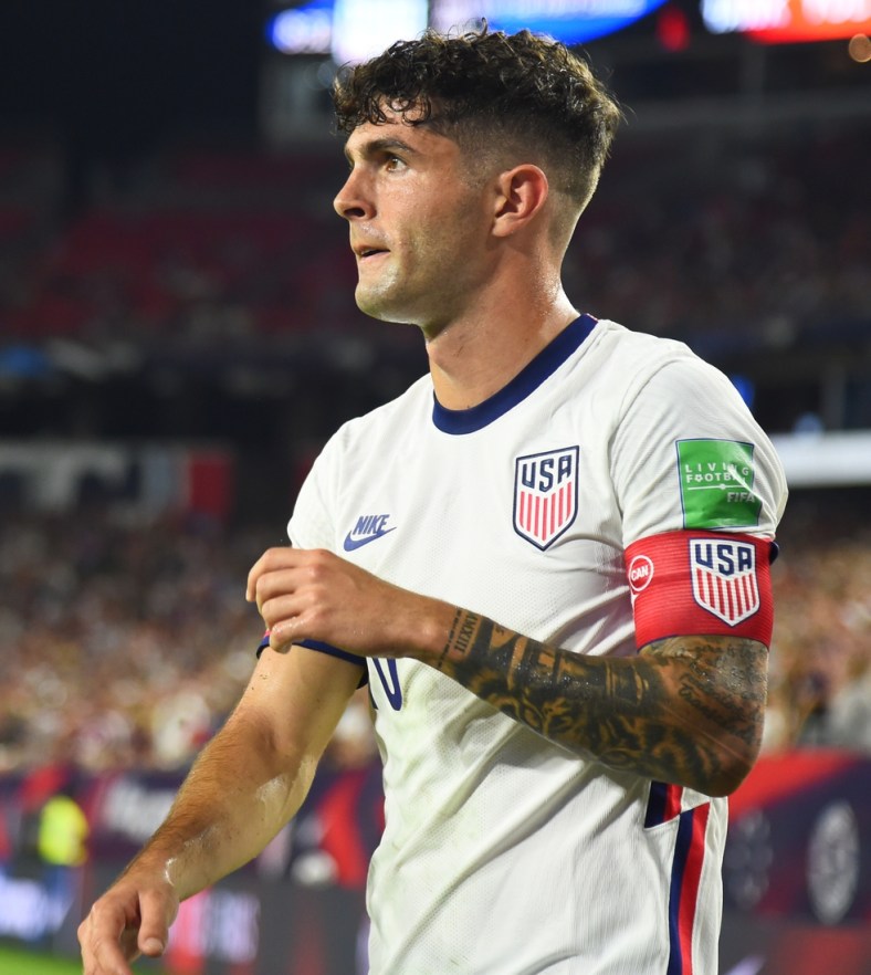 Sep 5, 2021; Nashville, Tennessee, USA; United States star Christian Pulisic (10) on a corner kick against Canada during a CONCACAF FIFA World Cup Qualifier soccer match at Nissan Stadium. Mandatory Credit: Christopher Hanewinckel-USA TODAY Sports