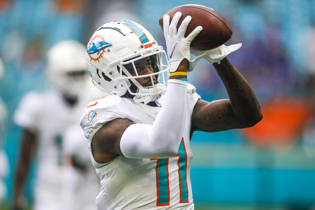 Sep 19, 2021; Miami Gardens, Florida, USA; Miami Dolphins wide receiver DeVante Parker (11) catches a football during a warmup exercise prior the game against the Buffalo Bills at Hard Rock Stadium. Mandatory Credit: Sam Navarro-USA TODAY Sports