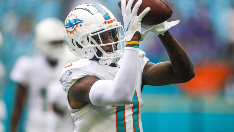 Sep 19, 2021; Miami Gardens, Florida, USA; Miami Dolphins wide receiver DeVante Parker (11) catches a football during a warmup exercise prior the game against the Buffalo Bills at Hard Rock Stadium. Mandatory Credit: Sam Navarro-USA TODAY Sports