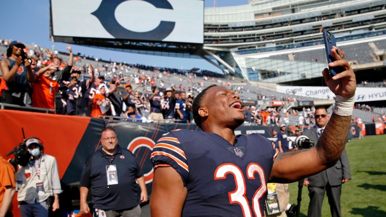 Sep 19, 2021; Chicago, Illinois, USA; Chicago Bears running back David Montgomery (32) celebrates with fans after their 20-17 win over the Cincinnati Bengals at Soldier Field. Mandatory Credit: Jon Durr-USA TODAY Sports