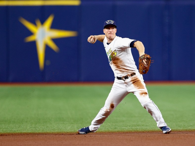 Sep 25, 2021; St. Petersburg, Florida, USA;  Tampa Bay Rays shortstop Joey Wendle (18) throws to first for an out in the first inning against the Miami Marlins at Tropicana Field. Mandatory Credit: Nathan Ray Seebeck-USA TODAY Sports