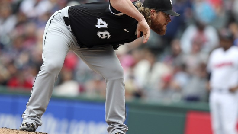 Sep 26, 2021; Cleveland, Ohio, USA;  Chicago White Sox relief pitcher Craig Kimbrel  (46) looks for a sign in the eigth inning against the Cleveland Indians at Progressive Field. Mandatory Credit: Aaron Josefczyk-USA TODAY Sports