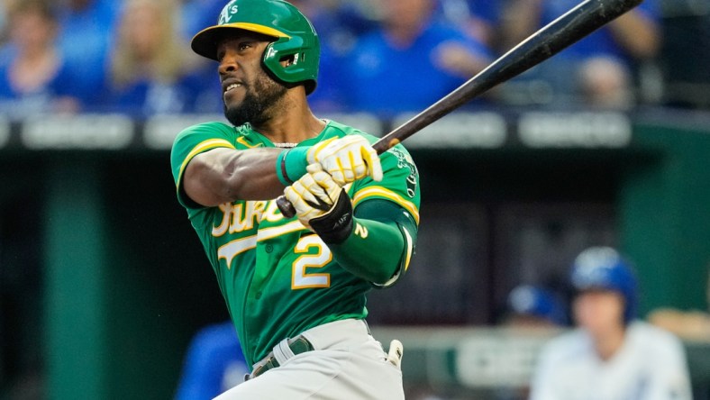 Sep 14, 2021; Kansas City, Missouri, USA; Oakland Athletics center fielder Starling Marte (2) hits a double against the Kansas City Royals during the first inning at Kauffman Stadium. Mandatory Credit: Jay Biggerstaff-USA TODAY Sports