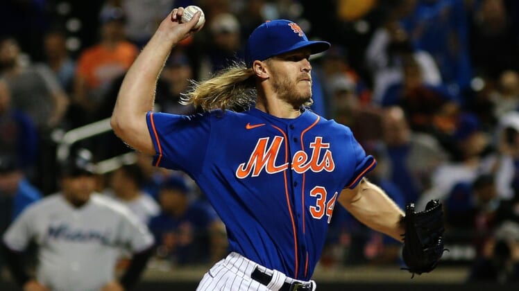 Sep 28, 2021; New York City, New York, USA; New York Mets starting pitcher Noah Syndergaard (34) delivers against the Miami Marlins during the first inning of game two of a doubleheader at Citi Field. Mandatory Credit: Andy Marlin-USA TODAY Sports