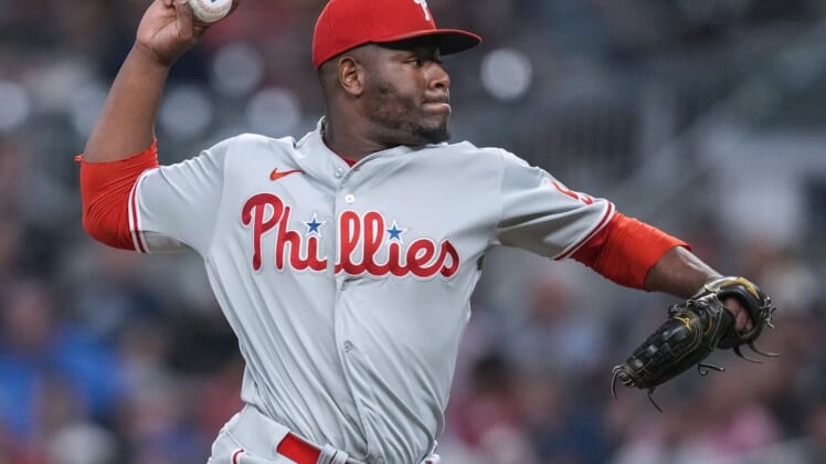 Sep 28, 2021; Cumberland, Georgia, USA; Philadelphia Phillies relief pitcher Hector Neris (50) pitches against the Atlanta Braves during the eighth inning at Truist Park. Mandatory Credit: Dale Zanine-USA TODAY Sports