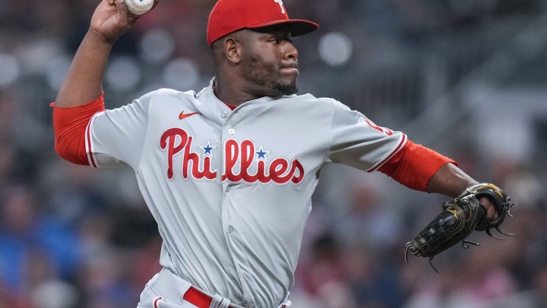 Sep 28, 2021; Cumberland, Georgia, USA; Philadelphia Phillies relief pitcher Hector Neris (50) pitches against the Atlanta Braves during the eighth inning at Truist Park. Mandatory Credit: Dale Zanine-USA TODAY Sports