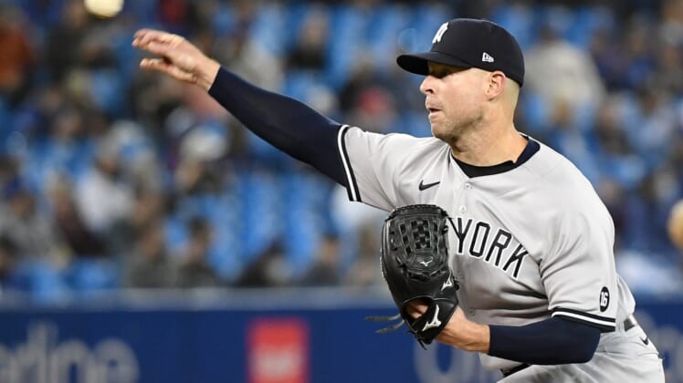 Sep 30, 2021; Toronto, Ontario, CAN;   New York Yankees starting pitcher Corey Kluber (28) delivers a pitch against Toronto Blue Jays in the first inning at Rogers Centre. Mandatory Credit: Dan Hamilton-USA TODAY Sports