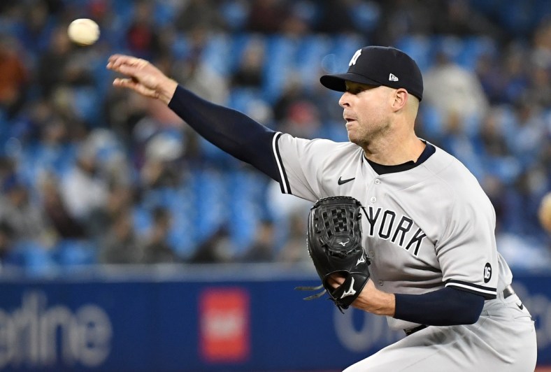 Sep 30, 2021; Toronto, Ontario, CAN;   New York Yankees starting pitcher Corey Kluber (28) delivers a pitch against Toronto Blue Jays in the first inning at Rogers Centre. Mandatory Credit: Dan Hamilton-USA TODAY Sports