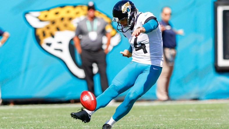 Sep 26, 2021; Jacksonville, Florida, USA;  Jacksonville Jaguars kicker Josh Lambo (4) kicks the ball in the third quarter against the Arizona Cardinals at TIAA Bank Field. Mandatory Credit: Nathan Ray Seebeck-USA TODAY Sports