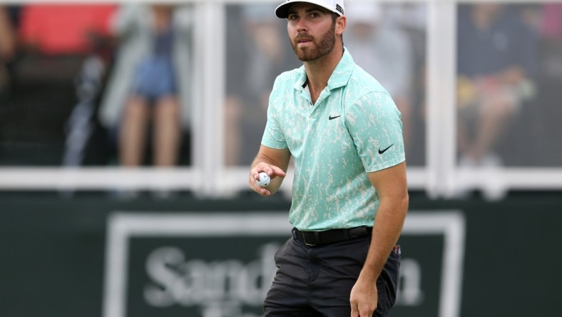 Oct 2, 2021; Jackson, Mississippi, USA; Matthew Wolff acknowledges the crowd on the 18th green during the third round of the Sanderson Farms Championship at the Country Club of Jackson. Mandatory Credit: Chuck Cook-USA TODAY Sports