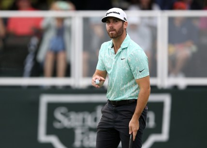 Oct 2, 2021; Jackson, Mississippi, USA; Matthew Wolff acknowledges the crowd on the 18th green during the third round of the Sanderson Farms Championship at the Country Club of Jackson. Mandatory Credit: Chuck Cook-USA TODAY Sports