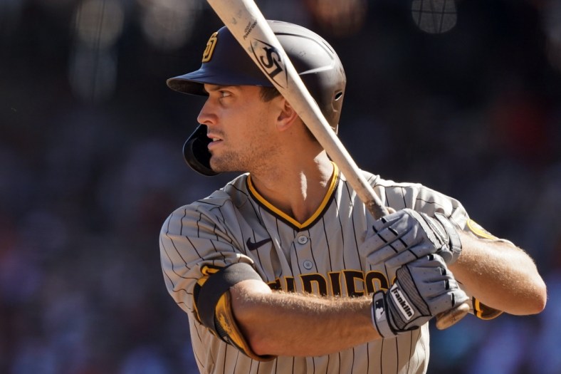 Oct 2, 2021; San Francisco, California, USA; San Diego Padres pinch hitter Adam Frazier (12) bats during the sixth inning against the San Francisco Giants at Oracle Park. Mandatory Credit: Darren Yamashita-USA TODAY Sports