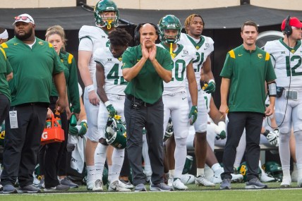 Oct 2, 2021; Stillwater, Oklahoma, USA;  Baylor Bears head coach Dave Aranda yells to his players on the field during the first quarter against the Oklahoma State Cowboys at Boone Pickens Stadium. Mandatory Credit: Brett Rojo-USA TODAY Sports