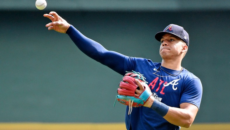 Oct 9, 2021; Milwaukee, Wisconsin, USA; Atlanta Braves third baseman Ehire Adrianza (23) warms up before game two of the 2021 NLDS against the Milwaukee Brewers at American Family Field. Mandatory Credit: Michael McLoone-USA TODAY Sports