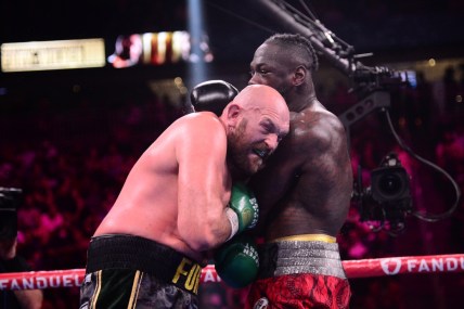 Oct 9, 2021; Las Vegas, Nevada, USA; Deontay Wilder (red/black trunks) and Tyson Fury (black/gold trunks) box during their WBC/Lineal heavyweight championship boxing match at T-Mobile Arena. Mandatory Credit: Joe Camporeale-USA TODAY Sports