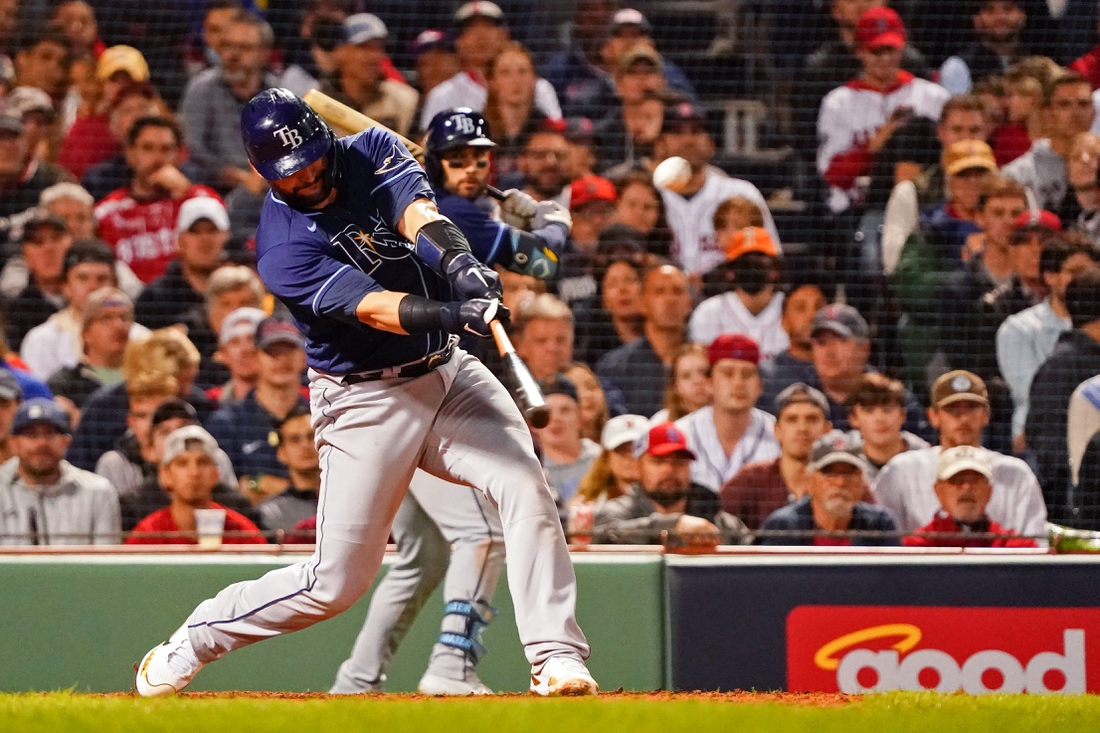 Oct 11, 2021; Boston, Massachusetts, USA; Tampa Bay Rays catcher Mike Zunino (10) hits a double against the Boston Red Sox during the eighth inning during game four of the 2021 ALDS at Fenway Park. Mandatory Credit: David Butler II-USA TODAY Sports