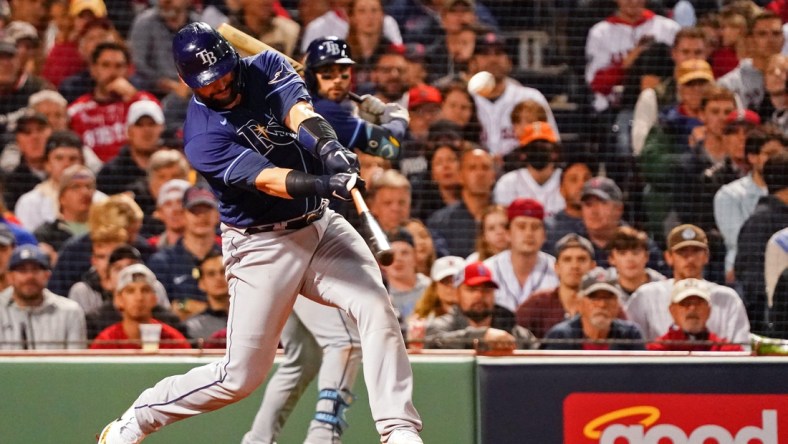 Oct 11, 2021; Boston, Massachusetts, USA; Tampa Bay Rays catcher Mike Zunino (10) hits a double against the Boston Red Sox during the eighth inning during game four of the 2021 ALDS at Fenway Park. Mandatory Credit: David Butler II-USA TODAY Sports