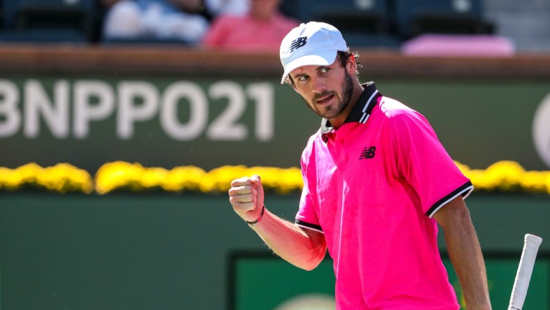 Tommy Paul of the United States celebrates a point against Cameron Norrie of Great Britain during their round four match of the BNP Paribas Open, Wednesday, Oct. 13, 2021, in Indian Wells, Calif.