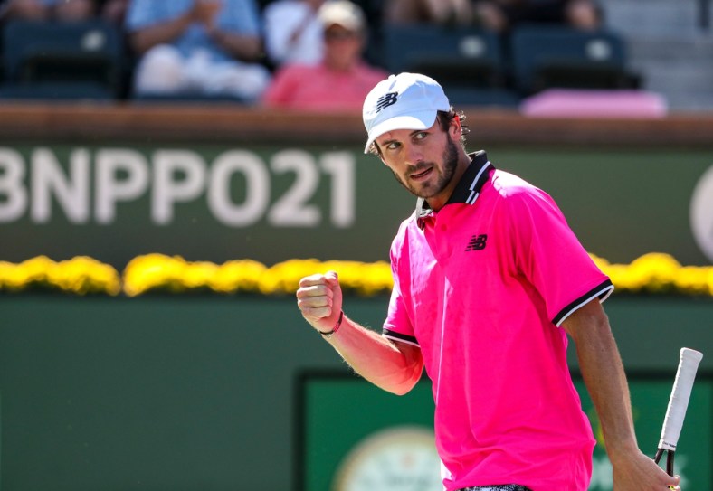 Tommy Paul of the United States celebrates a point against Cameron Norrie of Great Britain during their round four match of the BNP Paribas Open, Wednesday, Oct. 13, 2021, in Indian Wells, Calif.