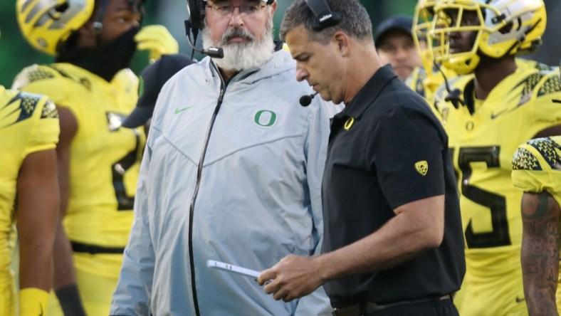 Oregon offensive coordinator Joe Moorhead, left, and head coach Mario Cristobal, on the sidelines during the game against Stony Brook.

Eug 101421 Moorhead05