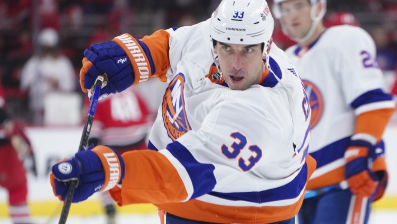 Oct 14, 2021; Raleigh, North Carolina, USA;  New York Islanders defenseman Zdeno Chara (33) takes a shot before the game against the Carolina Hurricanes at PNC Arena. Mandatory Credit: James Guillory-USA TODAY Sports