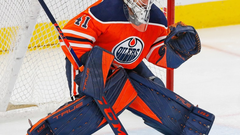 Oct 7, 2021; Edmonton, Alberta, CAN; Edmonton Oilers goaltender Mike Smith (41) skates against the Vancouver Canucks at Rogers Place. Mandatory Credit: Perry Nelson-USA TODAY Sports