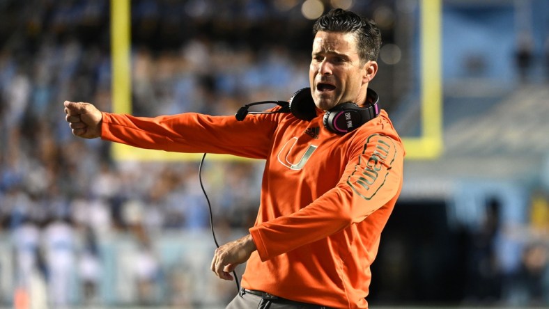 Oct 16, 2021; Chapel Hill, North Carolina, USA;  Miami Hurricanes head coach Manny Diaz reacts in the fourth quarter at Kenan Memorial Stadium. Mandatory Credit: Bob Donnan-USA TODAY Sports