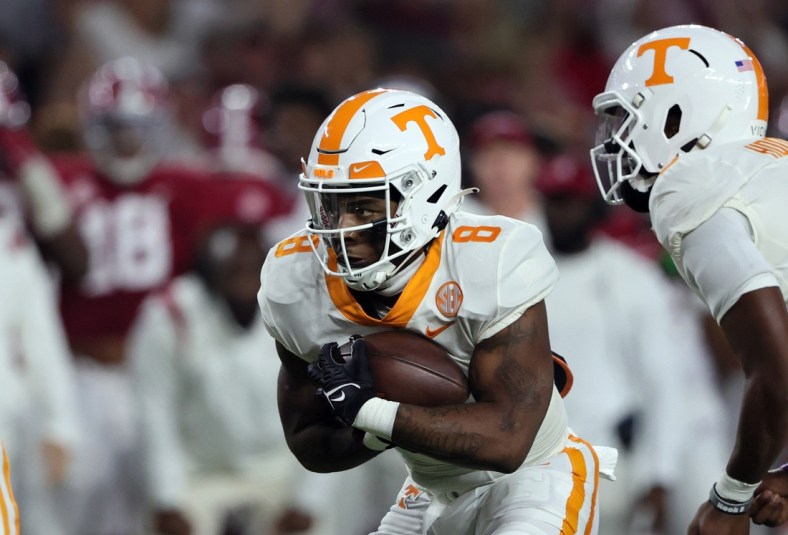 Oct 23, 2021; Tuscaloosa, Alabama, USA; Tennessee Volunteers running back Tiyon Evans (8) carries the ball against the Alabama Crimson Tide during the first half at Bryant-Denny Stadium. Mandatory Credit: Butch Dill-USA TODAY Sports