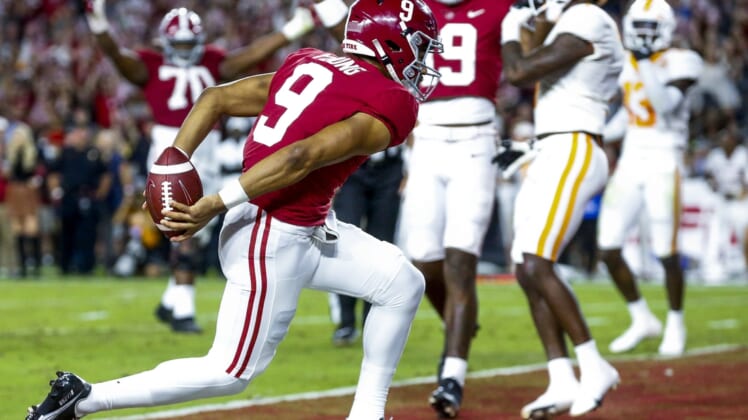 Oct 23, 2021; Tuscaloosa, Alabama, USA;  Alabama Crimson Tide quarterback Bryce Young (9) crosses the goal line to score a touchdown against the Tennessee Volunteers during the first half at Bryant-Denny Stadium. Mandatory Credit: Gary Cosby Jr.-USA TODAY Sports