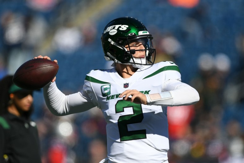 Oct 24, 2021; Foxborough, Massachusetts, USA; New York Jets quarterback Zach Wilson (2) throws a ball before the start of a game against the New England Patriots at Gillette Stadium. Mandatory Credit: Brian Fluharty-USA TODAY Sports