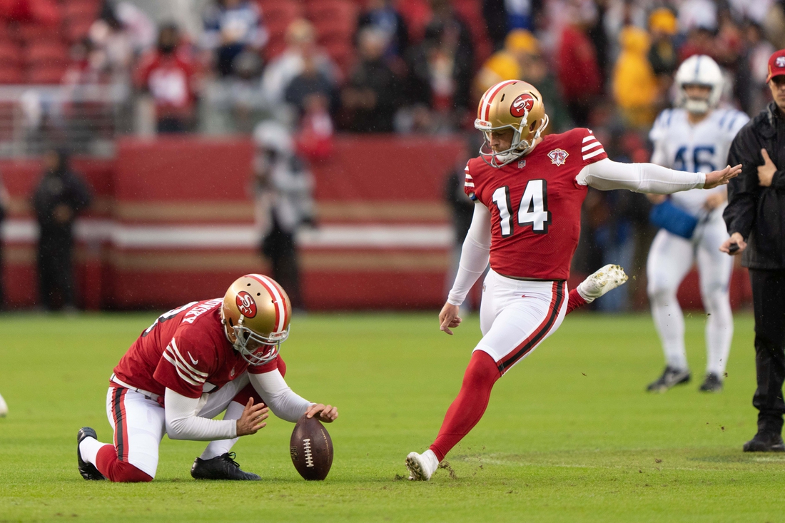 Oct 24, 2021; Santa Clara, California, USA;  San Francisco 49ers punter Mitch Wishnowsky (18) holds the ball for San Francisco 49ers kicker Joey Slye (14) during warmups before the game against the Indianapolis Colts at Levi's Stadium. Mandatory Credit: Stan Szeto-USA TODAY Sports