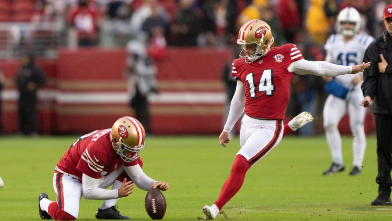 Oct 24, 2021; Santa Clara, California, USA;  San Francisco 49ers punter Mitch Wishnowsky (18) holds the ball for San Francisco 49ers kicker Joey Slye (14) during warmups before the game against the Indianapolis Colts at Levi's Stadium. Mandatory Credit: Stan Szeto-USA TODAY Sports