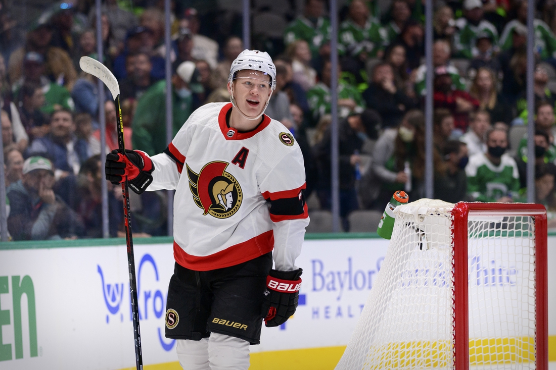 Oct 29, 2021; Dallas, Texas, USA; Ottawa Senators left wing Brady Tkachuk (7) celebrates a goal scored by center Josh Norris (not pictured) against the Dallas Stars during the first period at the American Airlines Center. Mandatory Credit: Jerome Miron-USA TODAY Sports