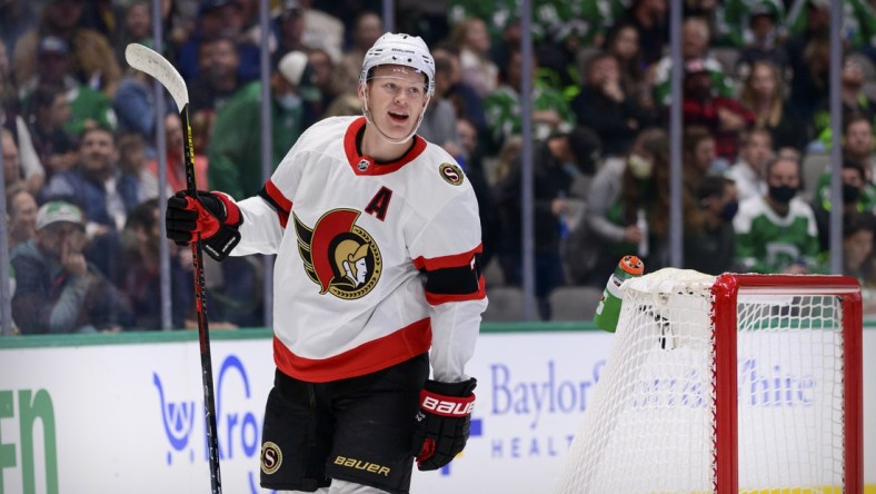 Oct 29, 2021; Dallas, Texas, USA; Ottawa Senators left wing Brady Tkachuk (7) celebrates a goal scored by center Josh Norris (not pictured) against the Dallas Stars during the first period at the American Airlines Center. Mandatory Credit: Jerome Miron-USA TODAY Sports