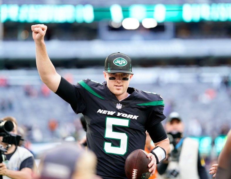 New York Jets quarterback Mike White (5) runs off the field with the game ball after defeating the Cincinnati Bengals, 34-31, at MetLife Stadium on Sunday, Oct. 31, 2021, in East Rutherford.

Nyj Vs Cin