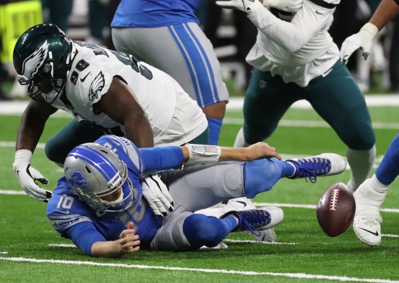 Detroit Lions quarterback Jared Goff (16) fumbles after being his by Philadelphia Eagles defensive tackle Hassan Ridgeway (98) during second half action at Ford Field Sunday, Oct. 31, 2021.

Detroit Lions