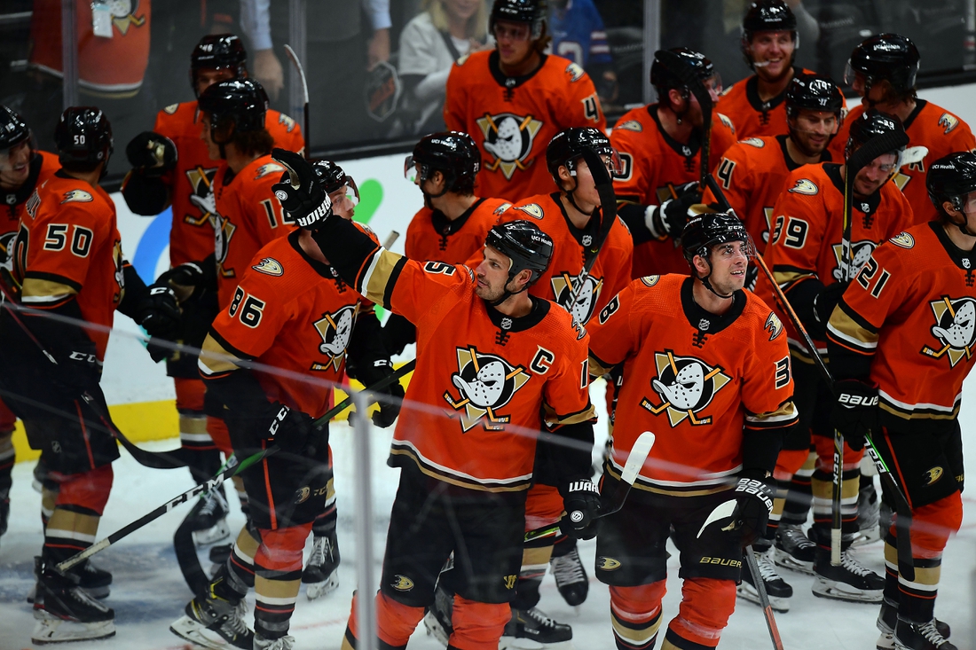 Oct 31, 2021; Anaheim, California, USA; Anaheim Ducks celebrate the assist recorded by center Ryan Getzlaf (15) on center Troy Terry (19) goal against the Montreal Canadiens during the third period at Honda Center. The assist puts Getzlaf as the all time points leader for the Anaheim Ducks. Mandatory Credit: Gary A. Vasquez-USA TODAY Sports