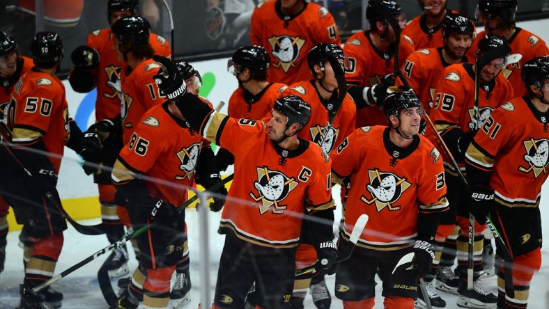 Oct 31, 2021; Anaheim, California, USA; Anaheim Ducks celebrate the assist recorded by center Ryan Getzlaf (15) on center Troy Terry (19) goal against the Montreal Canadiens during the third period at Honda Center. The assist puts Getzlaf as the all time points leader for the Anaheim Ducks. Mandatory Credit: Gary A. Vasquez-USA TODAY Sports