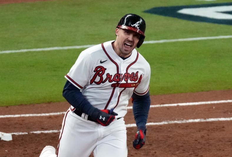 Oct 31, 2021; Atlanta, Georgia, USA; Atlanta Braves center fielder Adam Duvall (14) hits a grand slam home run against the Houston Astros during the first inning of game five of the 2021 World Series at Truist Park. Mandatory Credit: John David Mercer-USA TODAY Sports